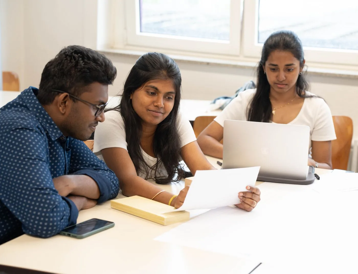 High-school students collaborating on a business idea